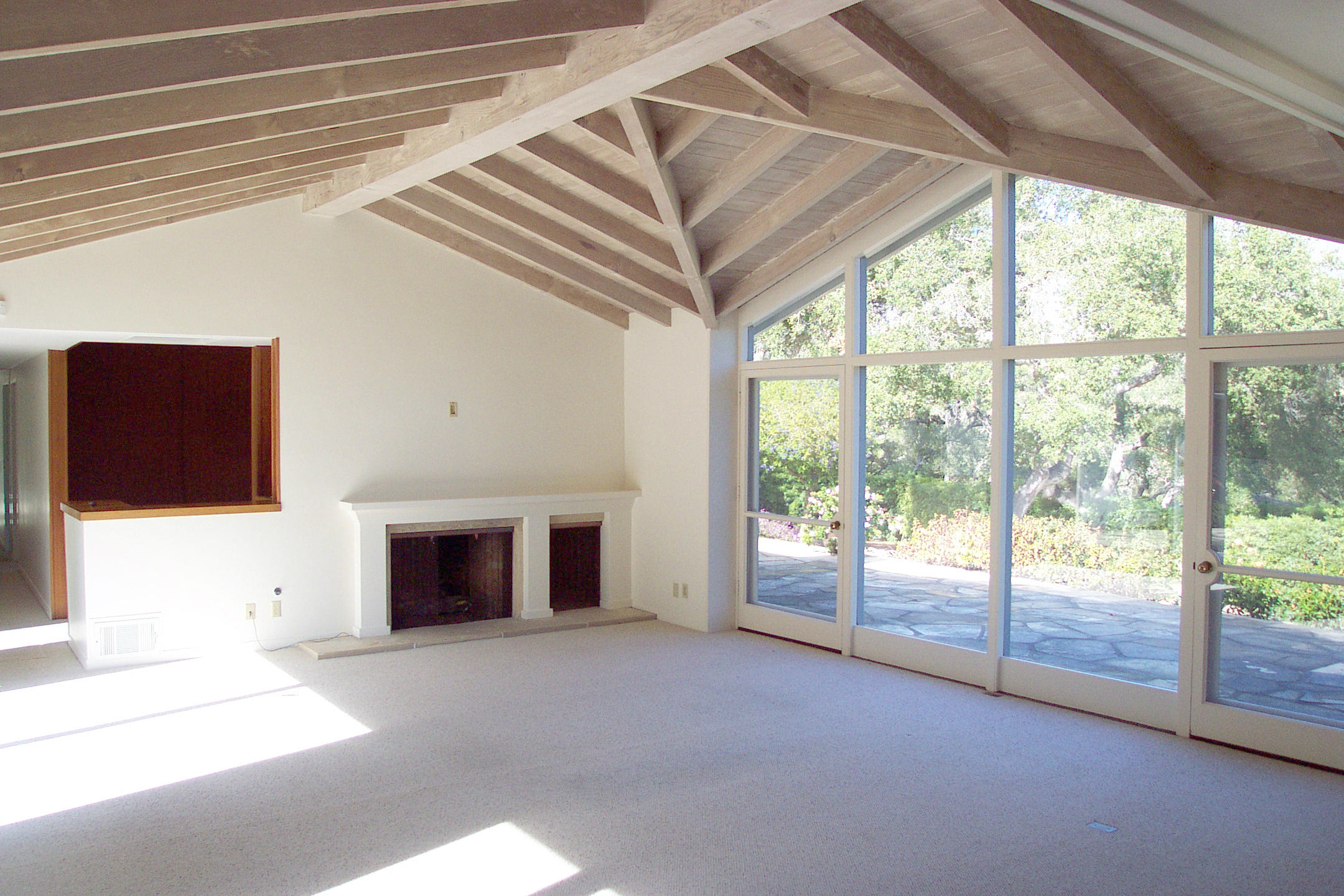 944 Arcady Road Montecito, CA 93108 - Photo 2 of 22 a view of an empty room with a fireplace and a window