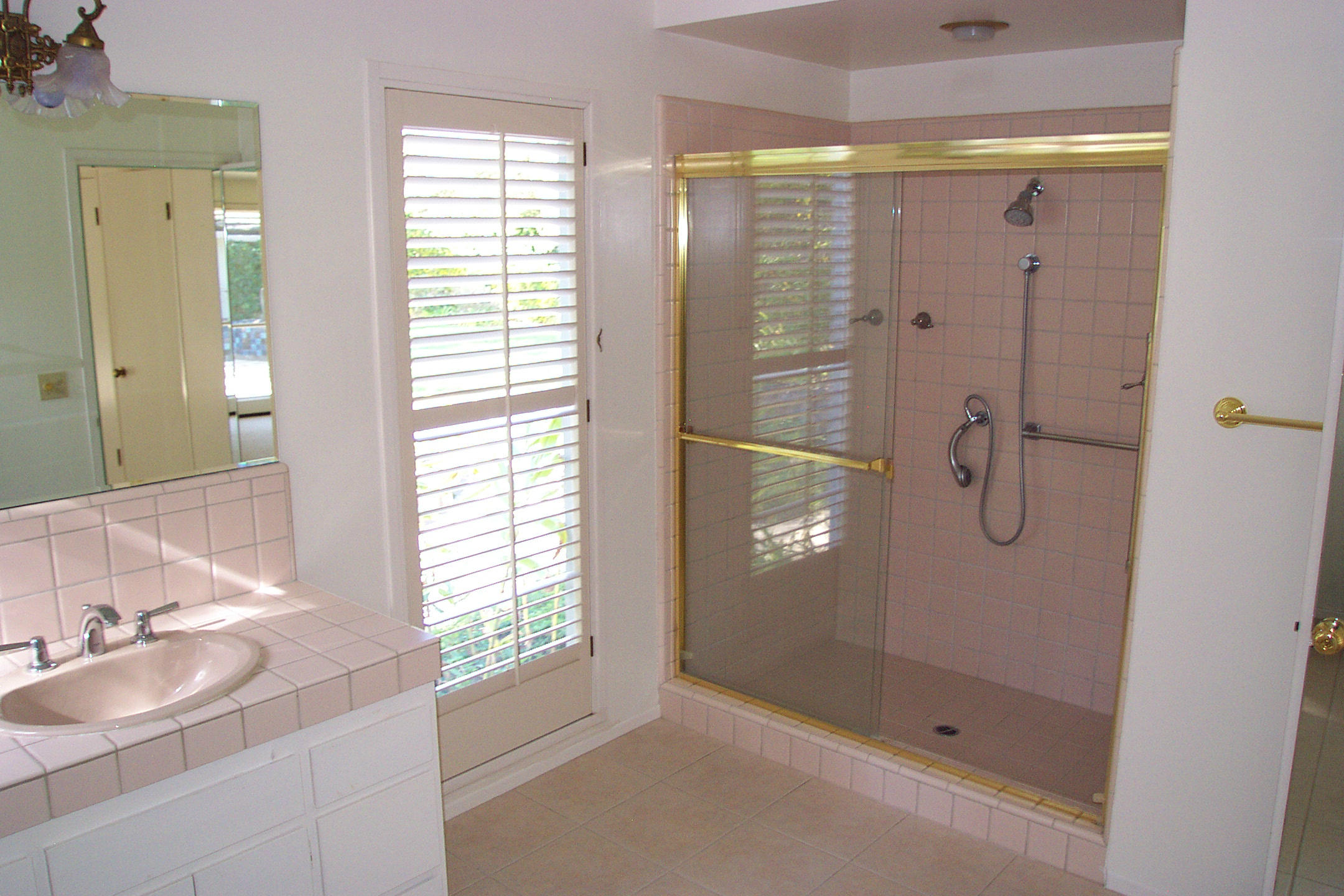 944 Arcady Road Montecito, CA 93108 - Photo 10 of 22 a bathroom with a granite countertop sink a shower and a mirror