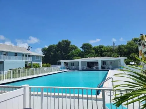 a view of a swimming pool with an outdoor seating
