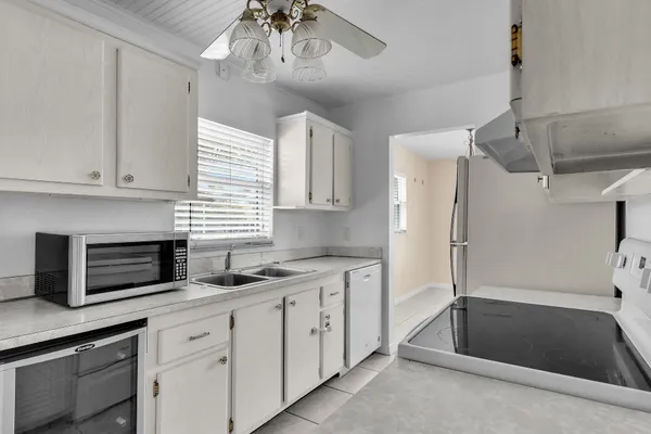 a work room with furniture and a flat screen tv