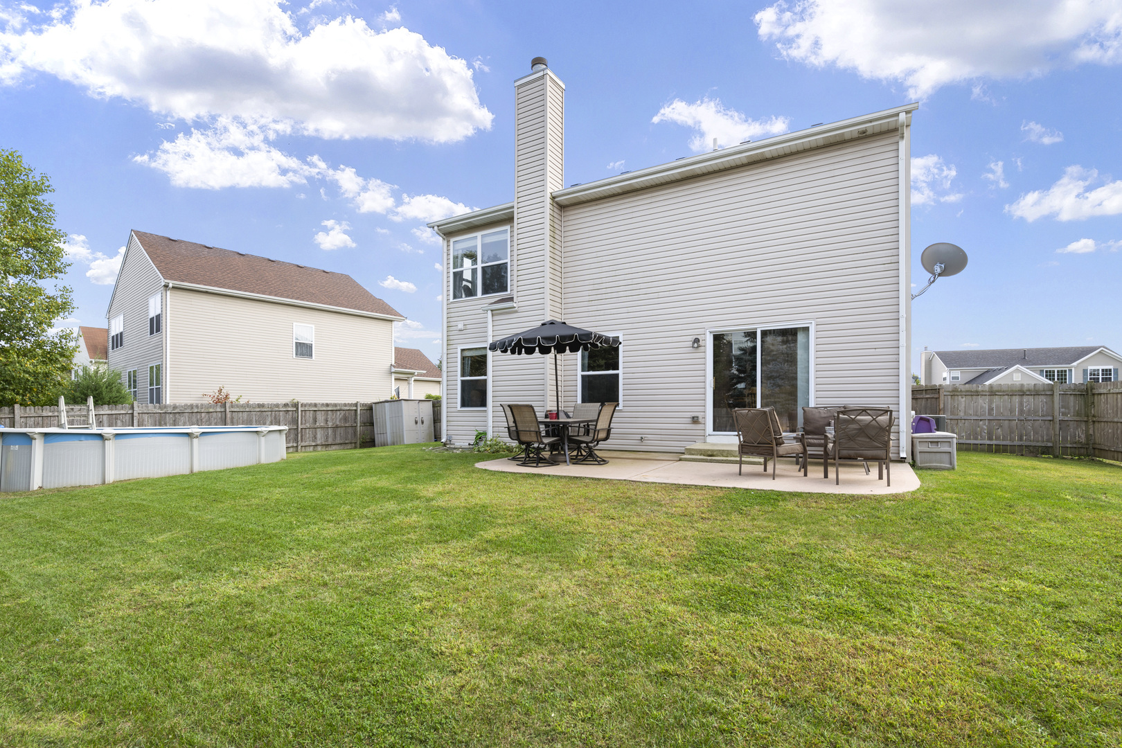 1924 Brimstone Road Romeoville, IL 60446 - Photo 22 of 30 a view of a house with backyard and sitting area