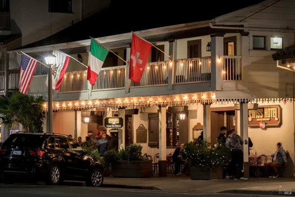 a front view of a building with lots of yellow lighting