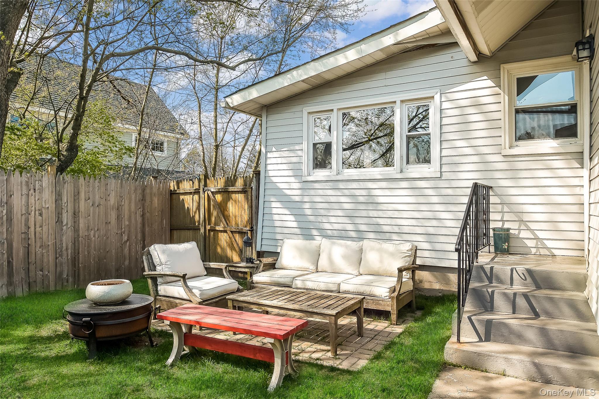 36 Dearborn Avenue Rye, NY 10580 - Photo 23 of 30 a backyard of a house with outdoor seating