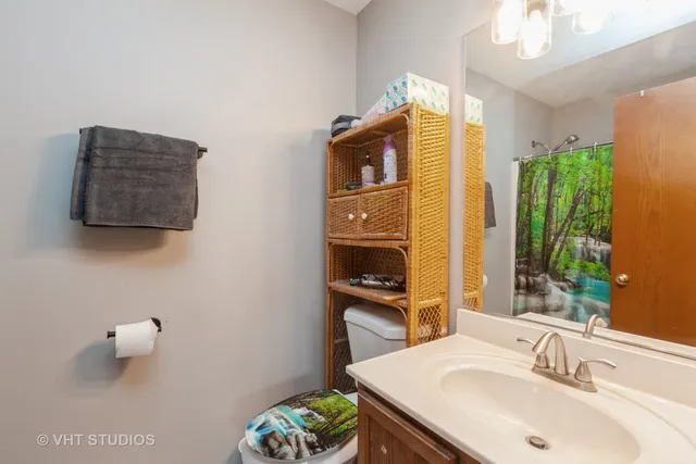 a bathroom with a sink a mirror and a toilet