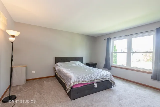 a room with a bed and a window