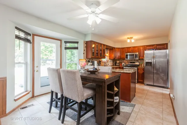 a view of a dining room with furniture window and outside view