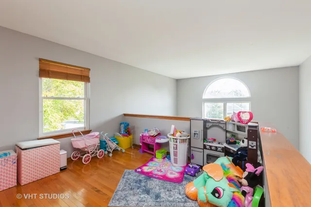a bed room with furniture and a window