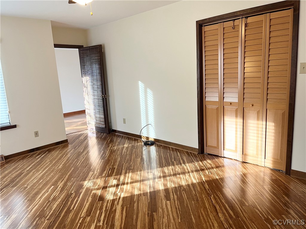 6220 Glebe Point Road Chesterfield, VA 23838 - Photo 27 of 50 a view of empty room with wooden floor and fan