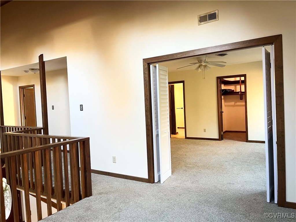 6220 Glebe Point Road Chesterfield, VA 23838 - Photo 44 of 50 a view of a hallway with wooden floor and stairs