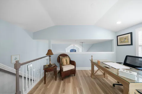 a bedroom with furniture and a window