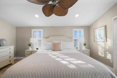 a bedroom with a bed and lamp