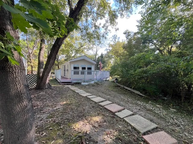 a front view of a house with trees