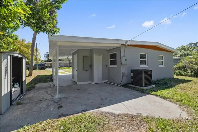 a view of a house with a backyard