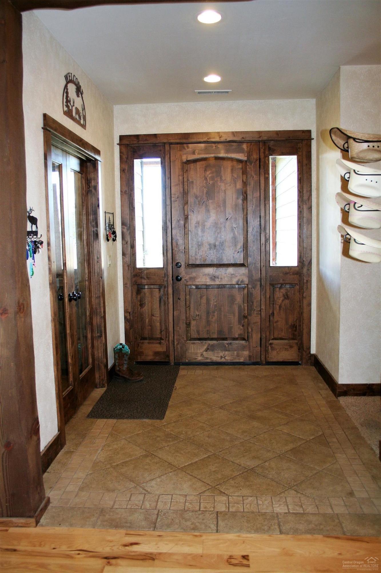 1364 Southwest Bent Loop Powell Butte, OR 97753 - Photo 5 of 25 Beautiful Entry with tile floor and den