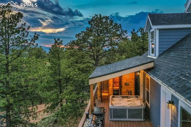 a view of a roof deck with wooden floor and fence