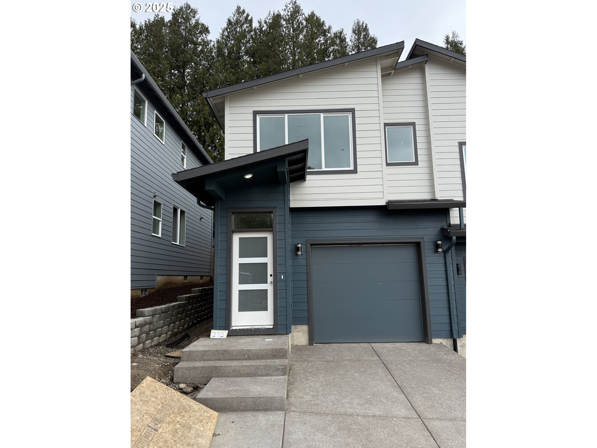 a front view of a house with a garage