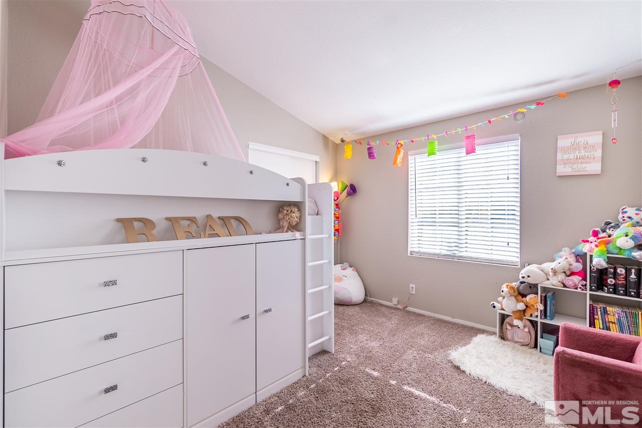 1298 Leopard Street Reno, NV 89506 - Photo 13 of 16 a bed room with a bed and a window