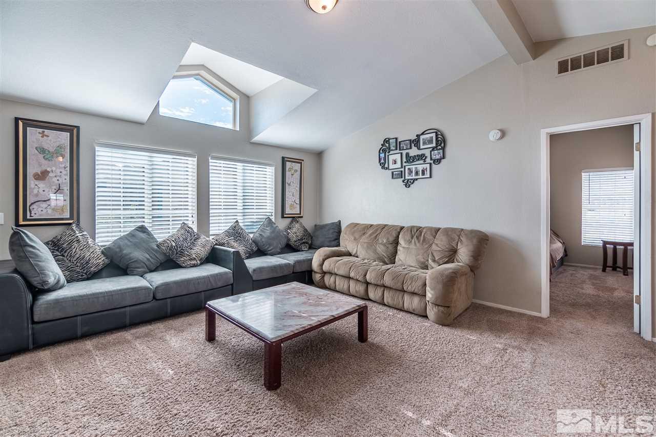 1298 Leopard Street Reno, NV 89506 - Photo 6 of 16 a living room with furniture and a large window