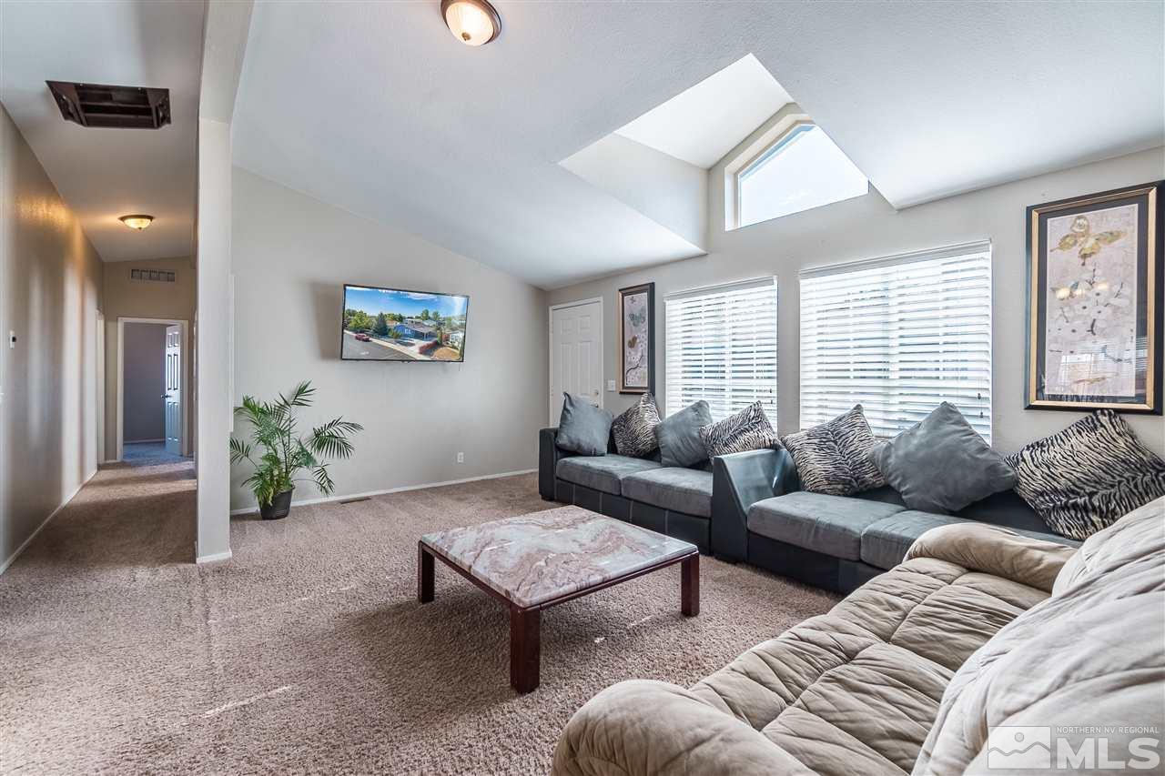 1298 Leopard Street Reno, NV 89506 - Photo 7 of 16 a living room with furniture and a window