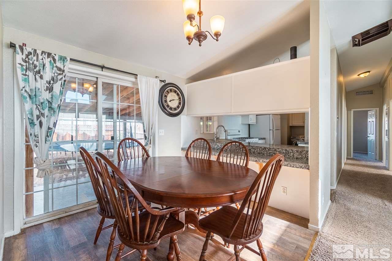 1298 Leopard Street Reno, NV 89506 - Photo 9 of 16 a dining room with furniture and wooden floor