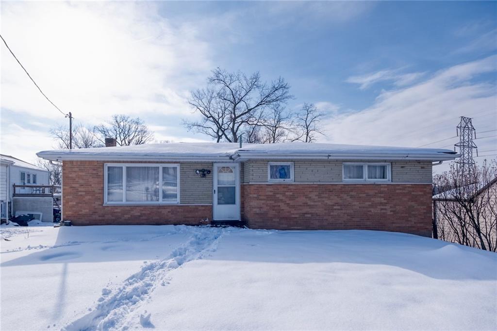 918 Stock Street Pittsburgh, PA 15207 - Photo 1 of 20 a front view of a house with a yard and garage
