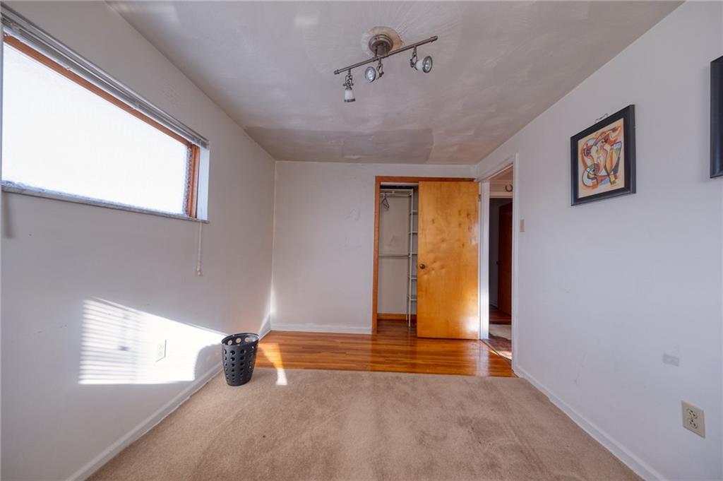 918 Stock Street Pittsburgh, PA 15207 - Photo 12 of 20 a view of an empty room with a window