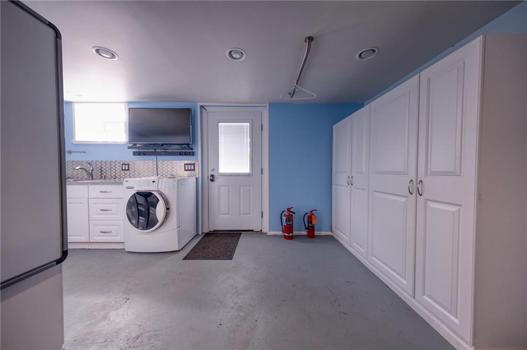 918 Stock Street Pittsburgh, PA 15207 - Photo 14 of 20 a view of a storage & utility room with washer and dryer