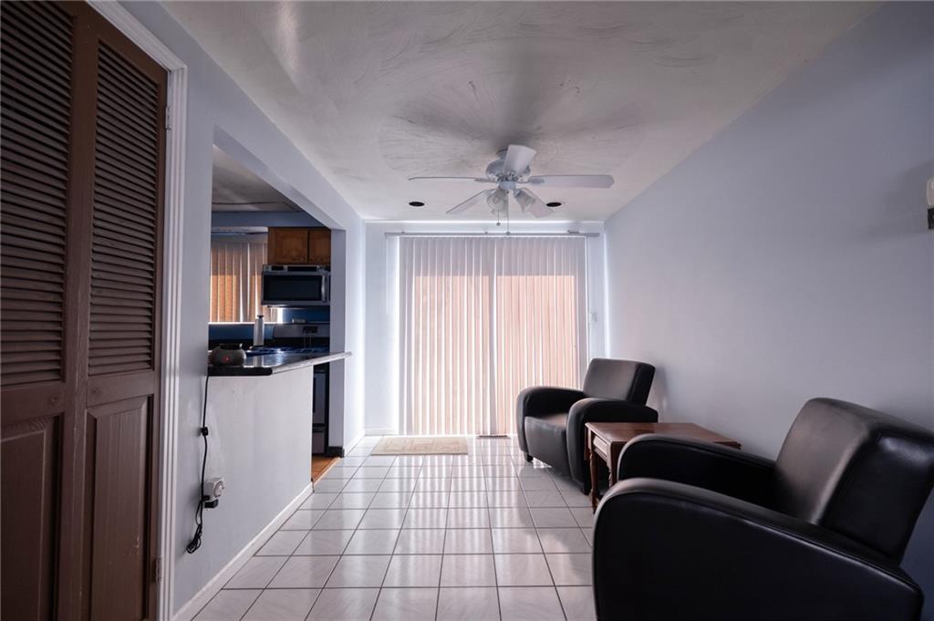 918 Stock Street Pittsburgh, PA 15207 - Photo 3 of 20 a living room with furniture and a flat screen tv
