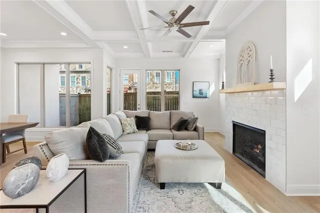 a living room with furniture fireplace and a window