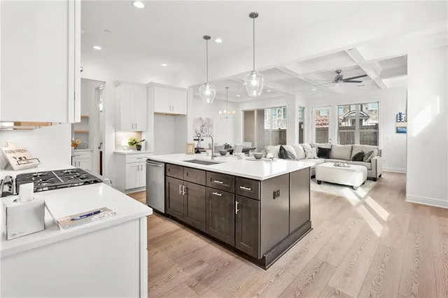 a kitchen with a sink stove and cabinets