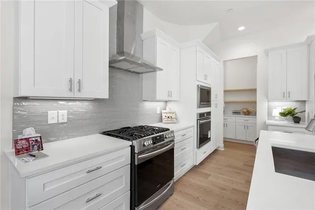 a kitchen with granite countertop a stove and a sink