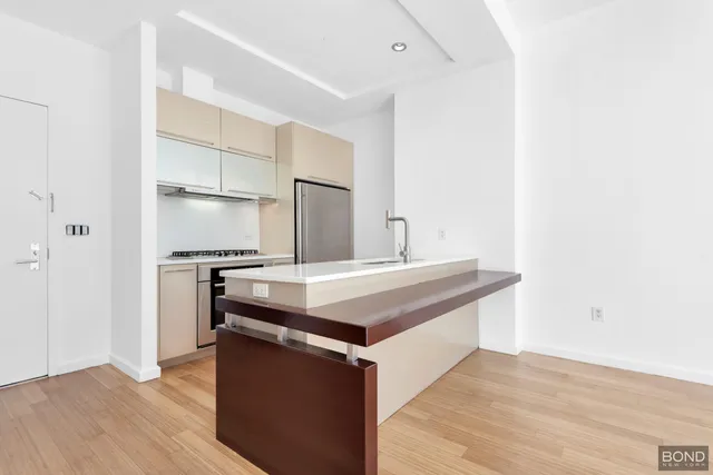 a kitchen with a stove and a refrigerator