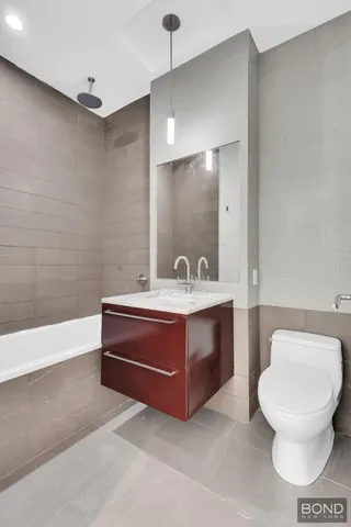 a kitchen with kitchen island a sink and wooden floor