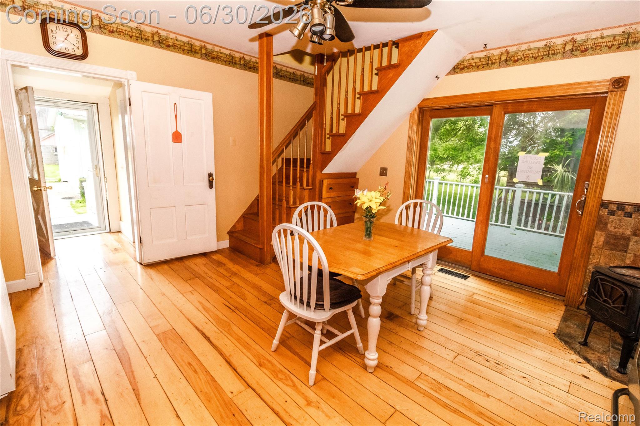 8150 Norman Road Imlay City, MI 48444 - Photo 12 of 58 Light wood-finish flooring throughout, featuring a natural wood staircase with white balusters