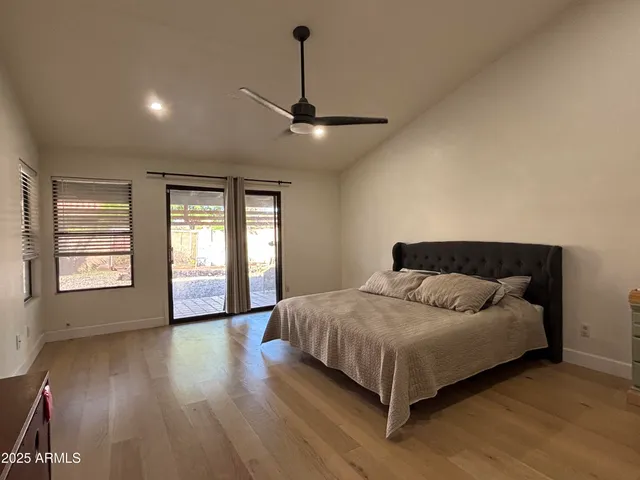 a bedroom with a bed and window
