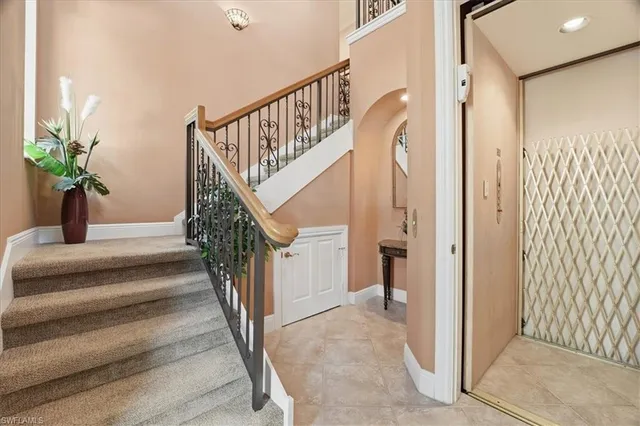 an aerial view of residential houses with outdoor space and river