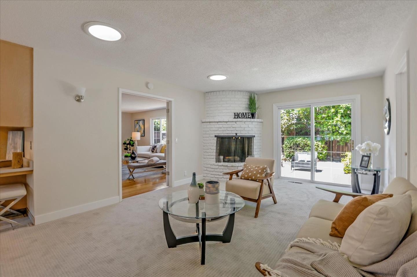 1660 Fordham Way Mountain View, CA 94040 - Photo 11 of 37 a living room with furniture and a fireplace