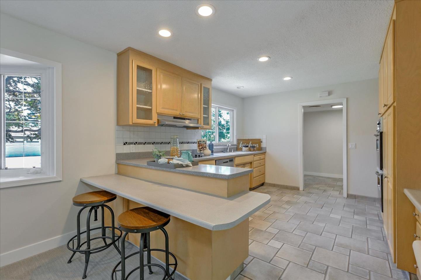 1660 Fordham Way Mountain View, CA 94040 - Photo 12 of 37 a kitchen with a sink cabinets and window