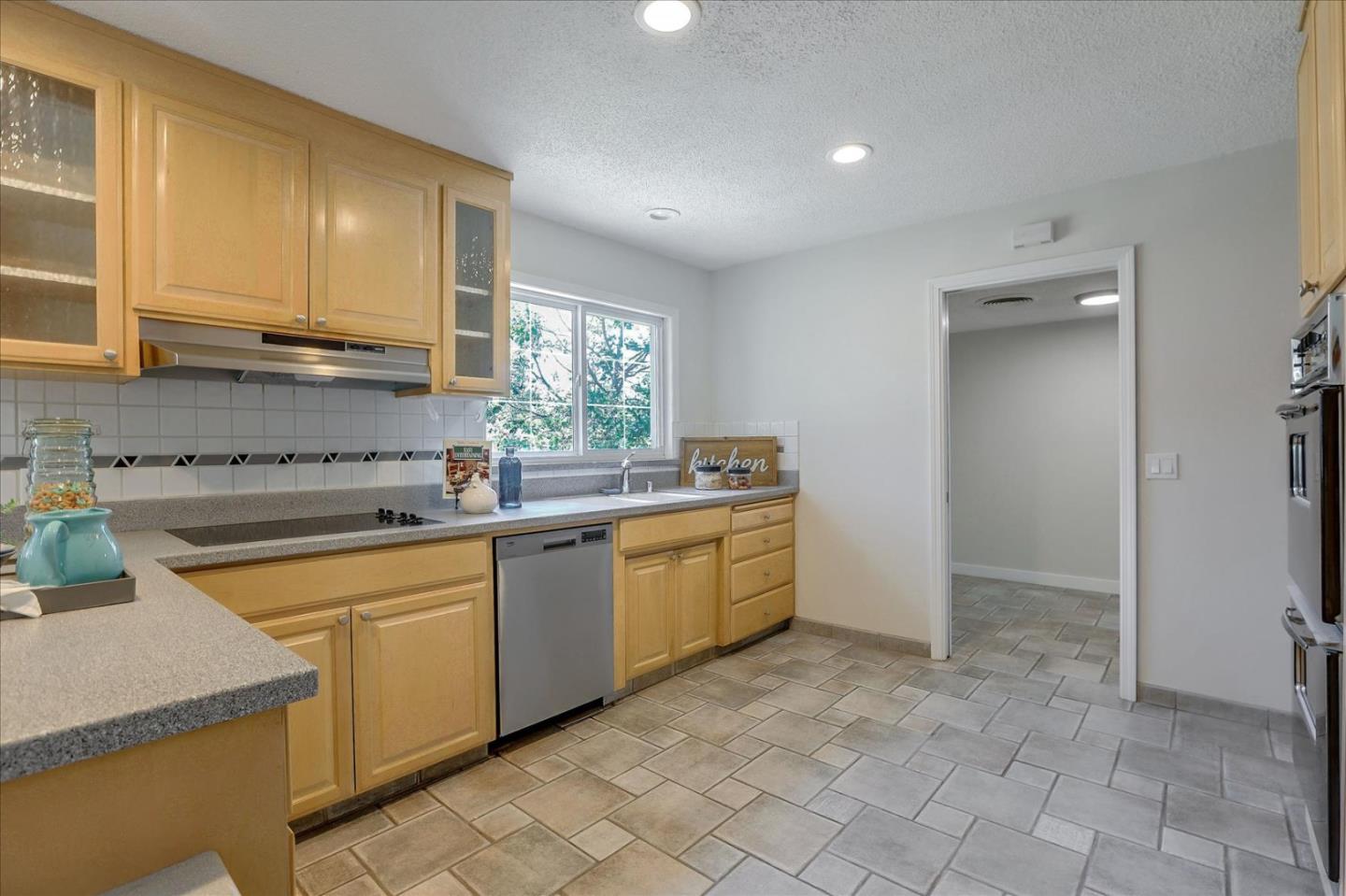 1660 Fordham Way Mountain View, CA 94040 - Photo 13 of 37 a kitchen that has a sink and a stove in it
