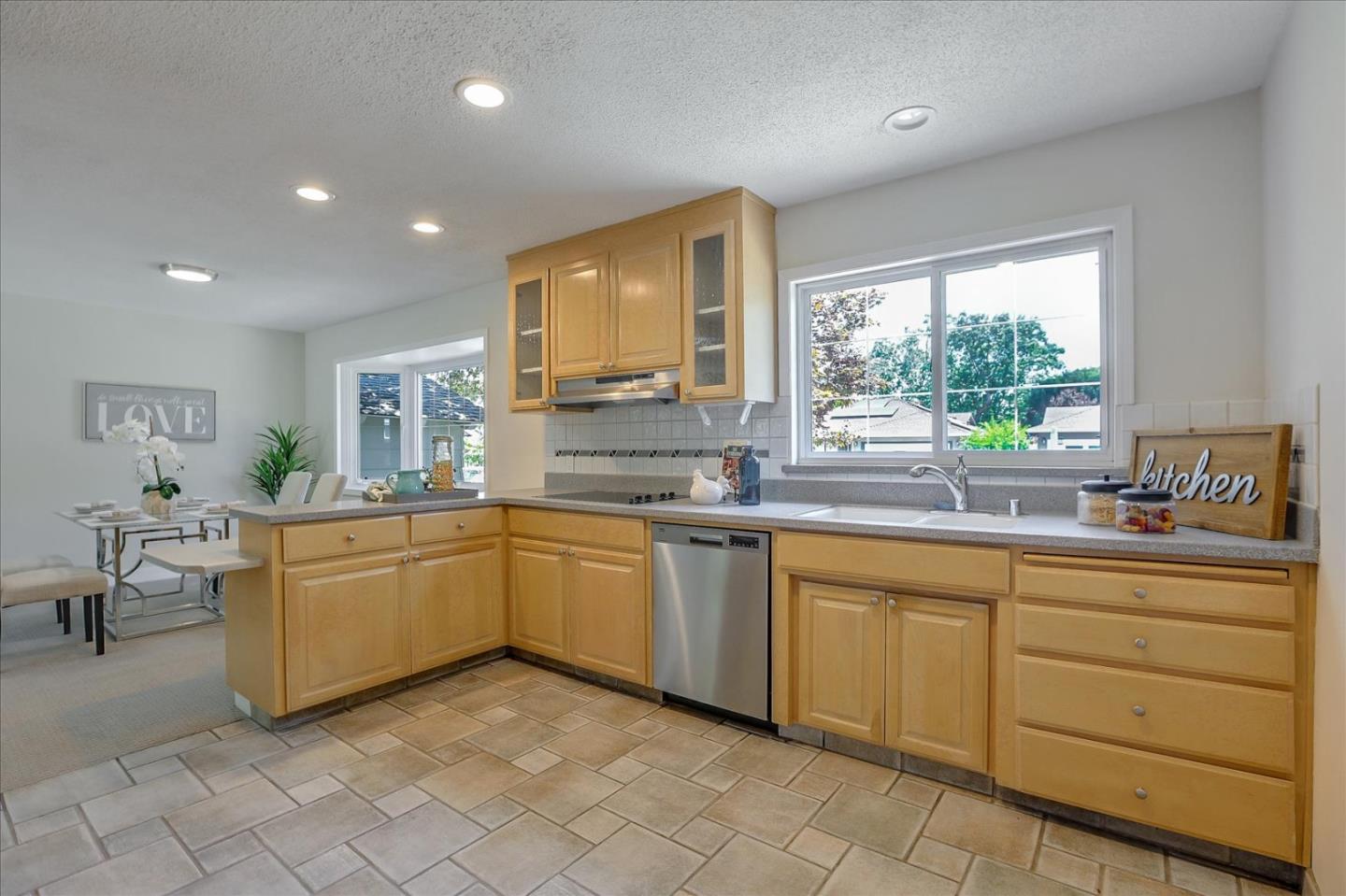 1660 Fordham Way Mountain View, CA 94040 - Photo 14 of 37 a kitchen with sink cabinets and window