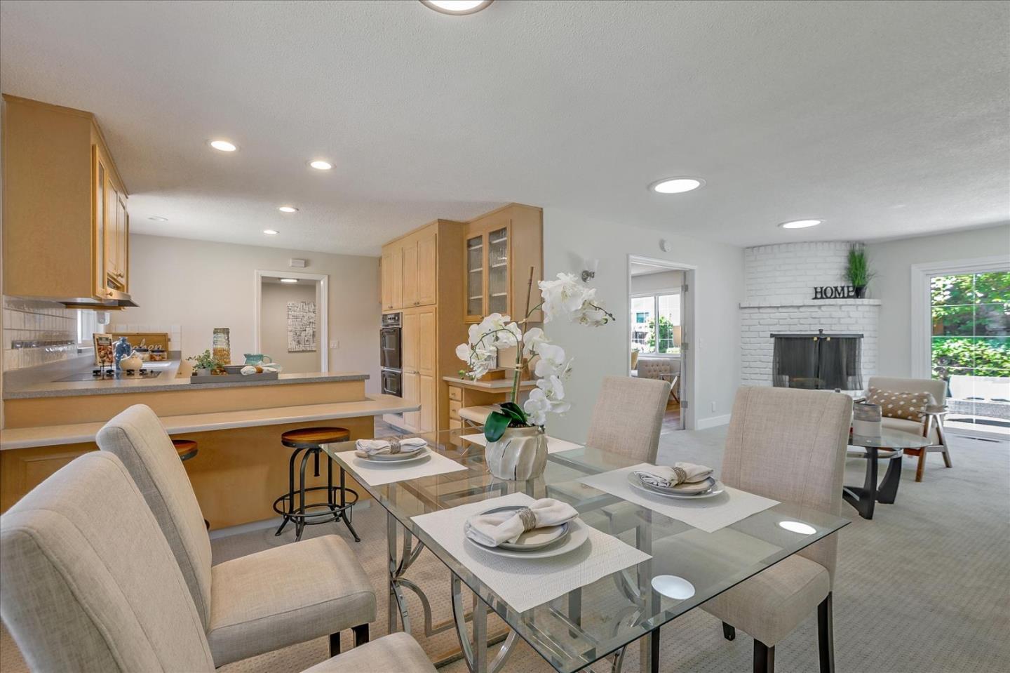 1660 Fordham Way Mountain View, CA 94040 - Photo 17 of 37 a living room with kitchen island furniture and a wooden floor