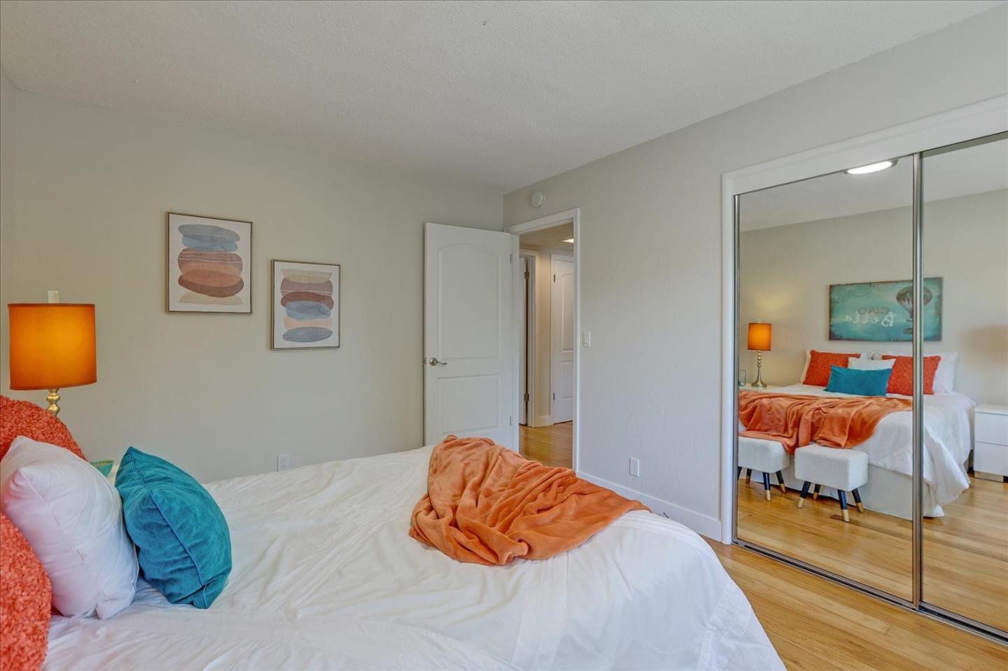 1660 Fordham Way Mountain View, CA 94040 - Photo 23 of 37 a bedroom with a bed and a lamp on table