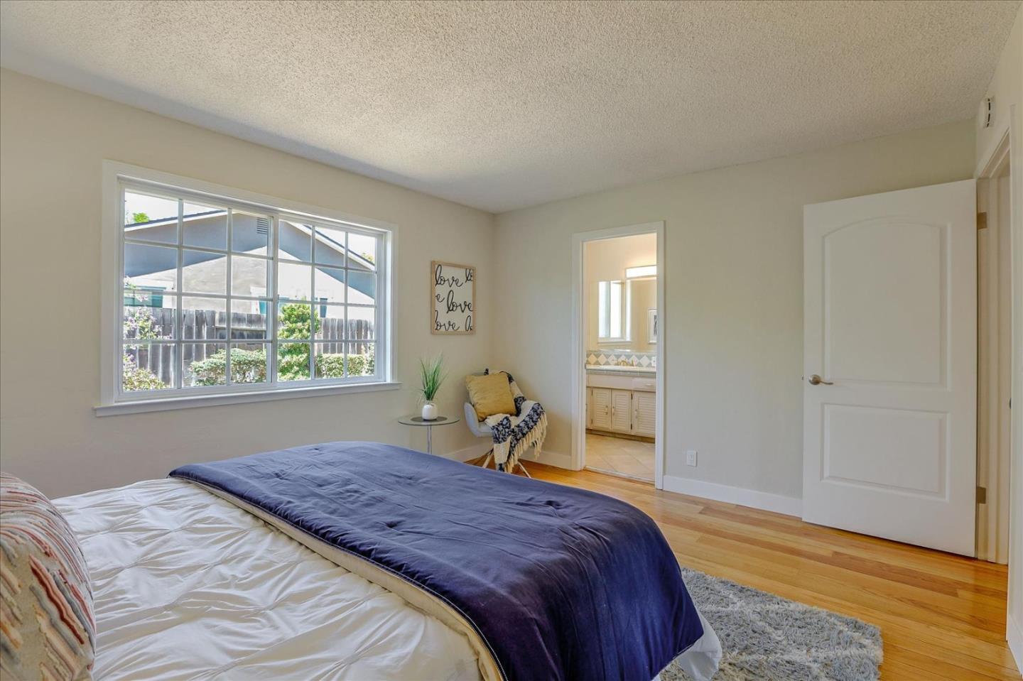 1660 Fordham Way Mountain View, CA 94040 - Photo 25 of 37 a bedroom with a bed and wooden floor