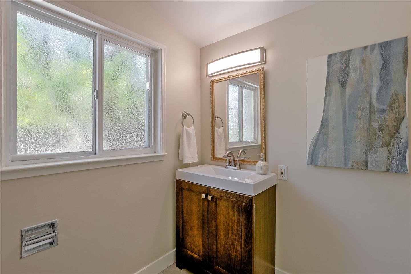 1660 Fordham Way Mountain View, CA 94040 - Photo 29 of 37 a bathroom with a sink a mirror and a window
