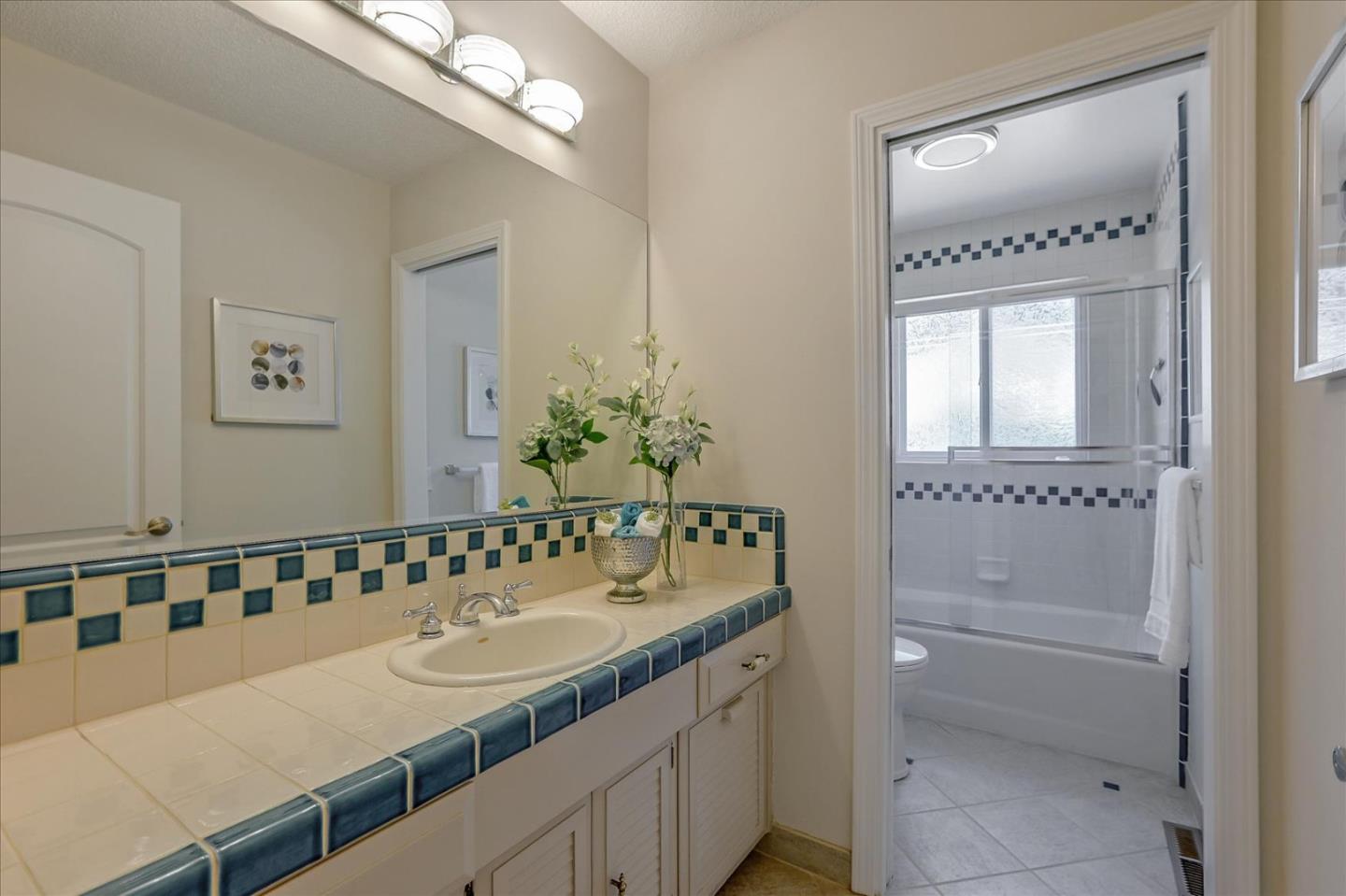 1660 Fordham Way Mountain View, CA 94040 - Photo 30 of 37 a bathroom with a sink and a mirror