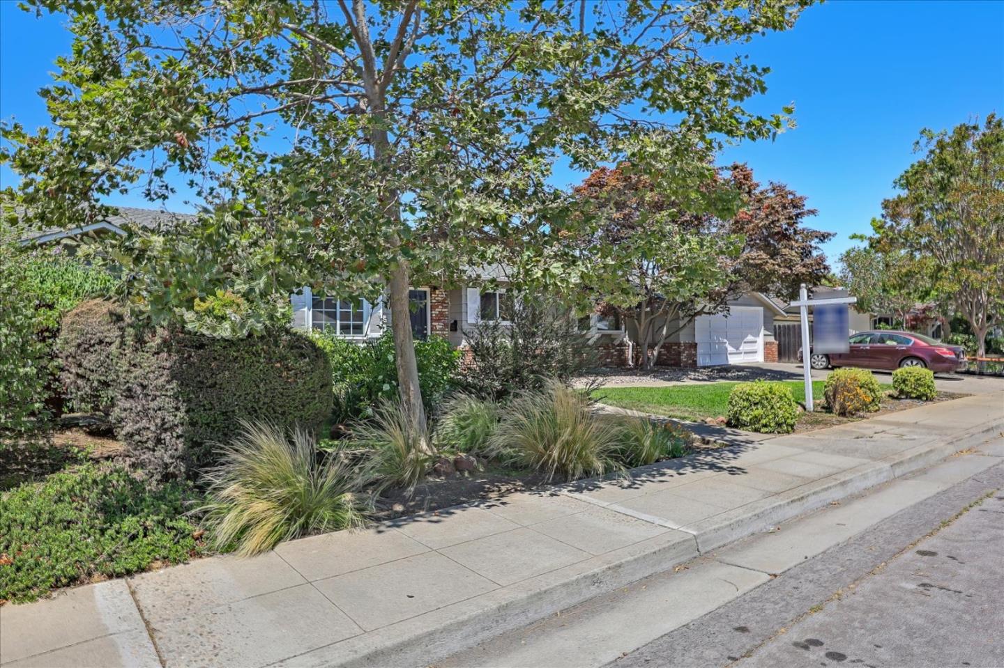 1660 Fordham Way Mountain View, CA 94040 - Photo 3 of 37 a front view of a house with a yard and potted plants