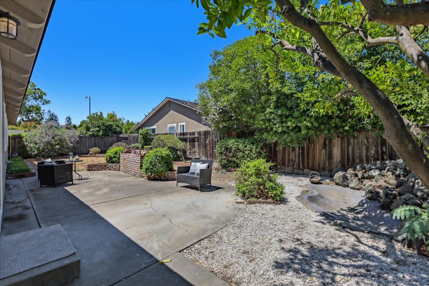 1660 Fordham Way Mountain View, CA 94040 - Photo 34 of 37 a backyard of a house with plants and tree
