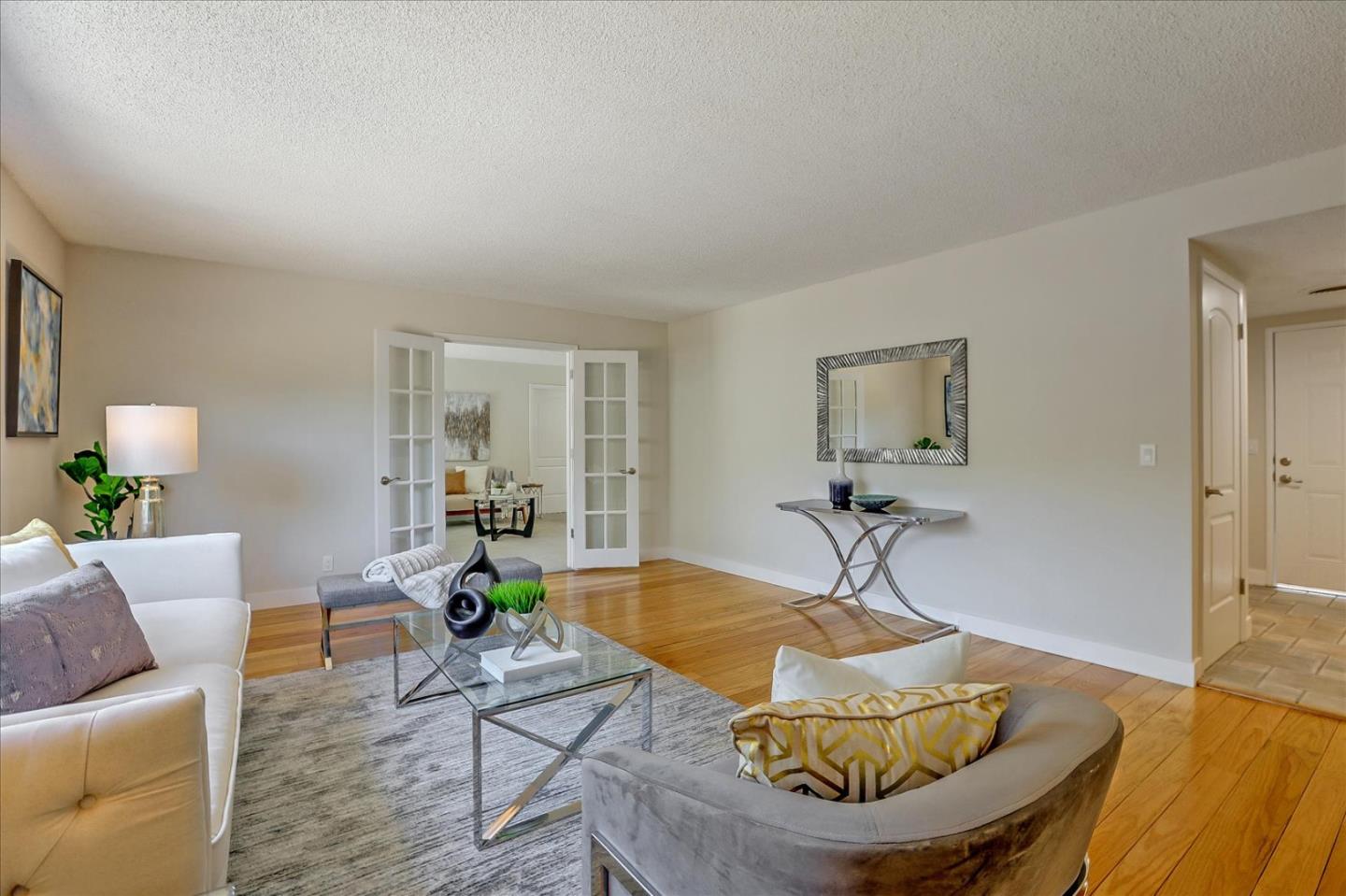 1660 Fordham Way Mountain View, CA 94040 - Photo 5 of 37 a living room with furniture and a potted plant