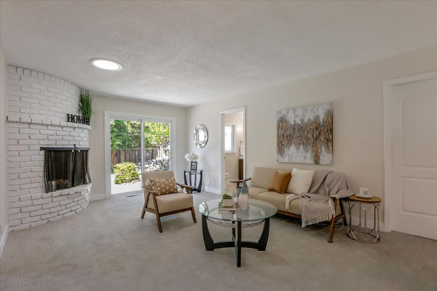 1660 Fordham Way Mountain View, CA 94040 - Photo 10 of 37 a living room with furniture and a fireplace
