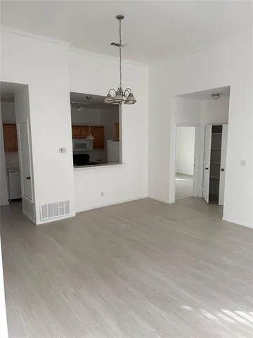 a view of a windows and a kitchen space in a room